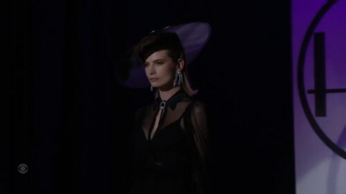 model in black hat bold