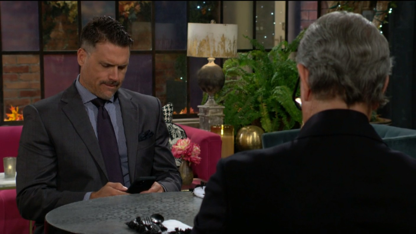 nick looks at his phone with victor at society young and restless recaps soapsspoilers