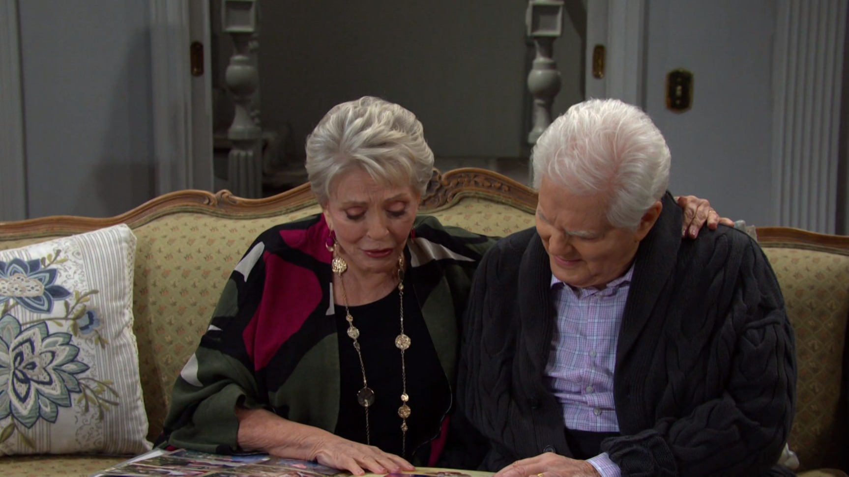 doug and julie look at photos of loved ones Days of our Lives recaps