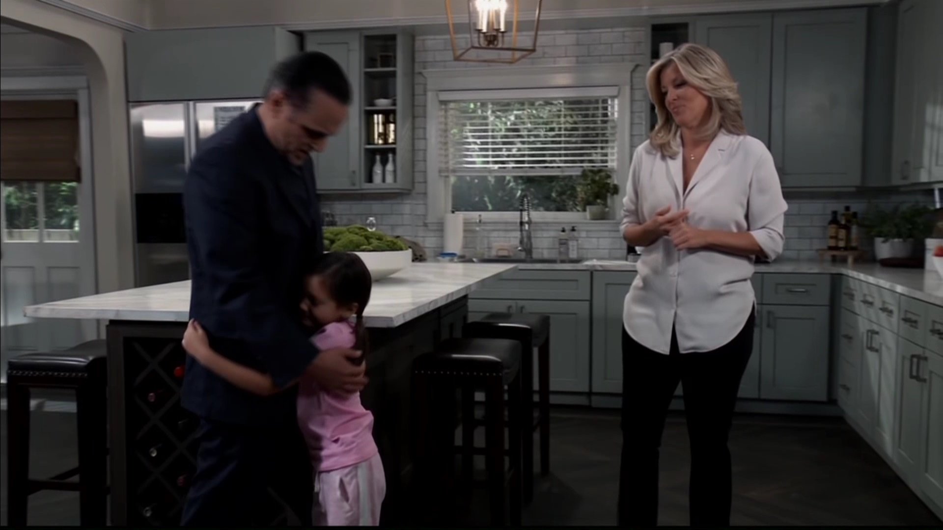 sonny greets his kid donna as carly looks on.