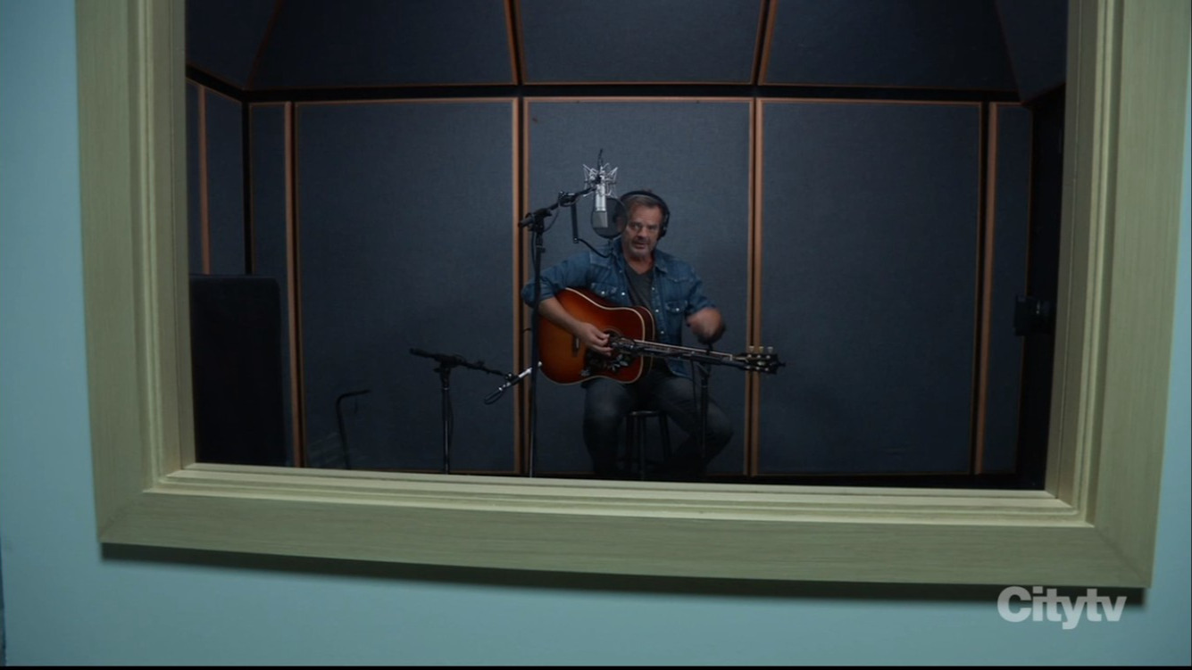 ned singing in booth