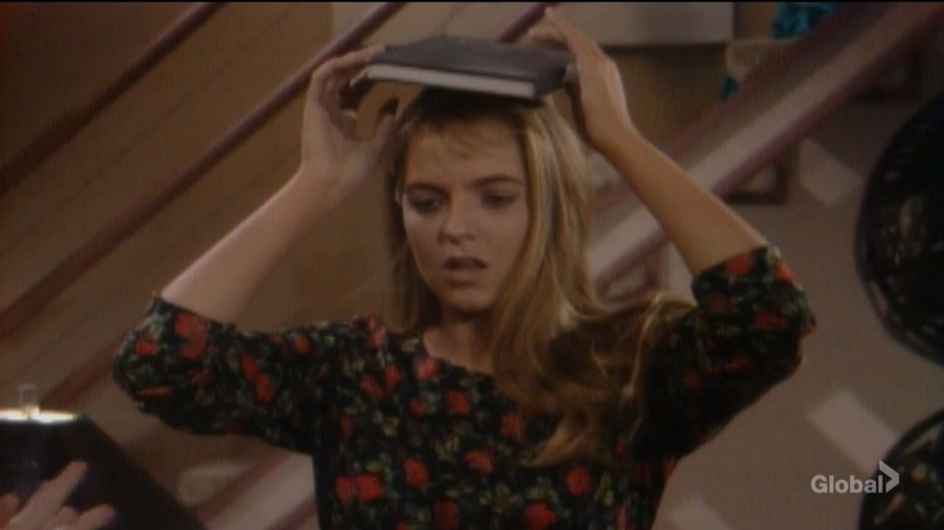 nina book on her head transforming herself