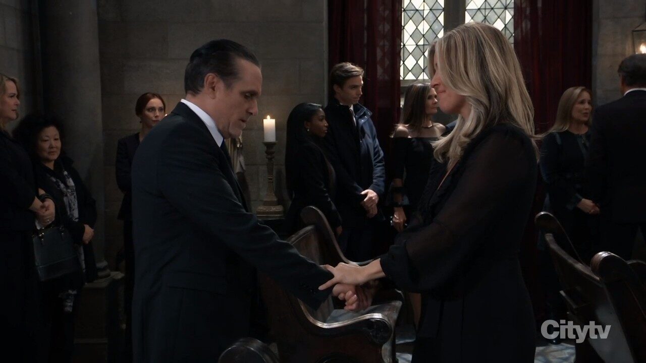 sonny holds carly's hand