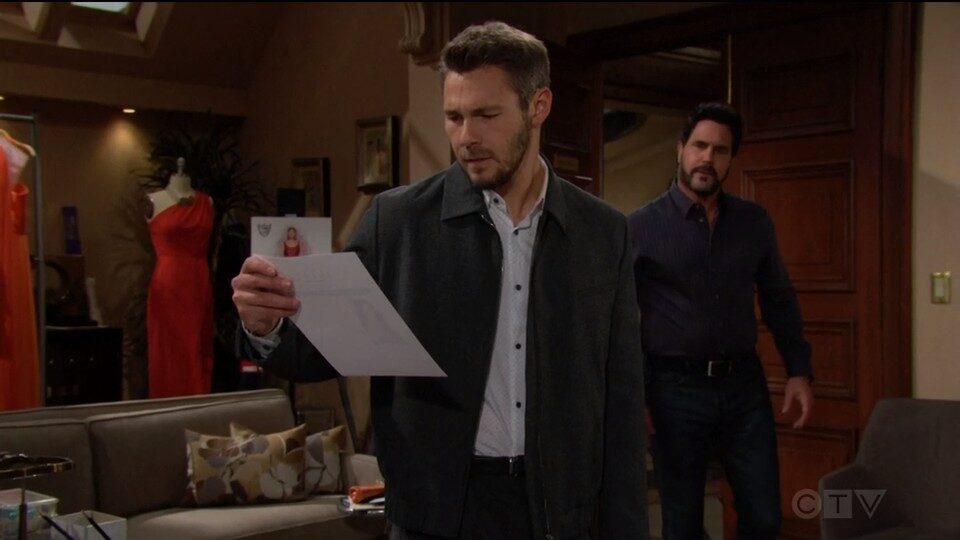 liam looking at steffy picture
