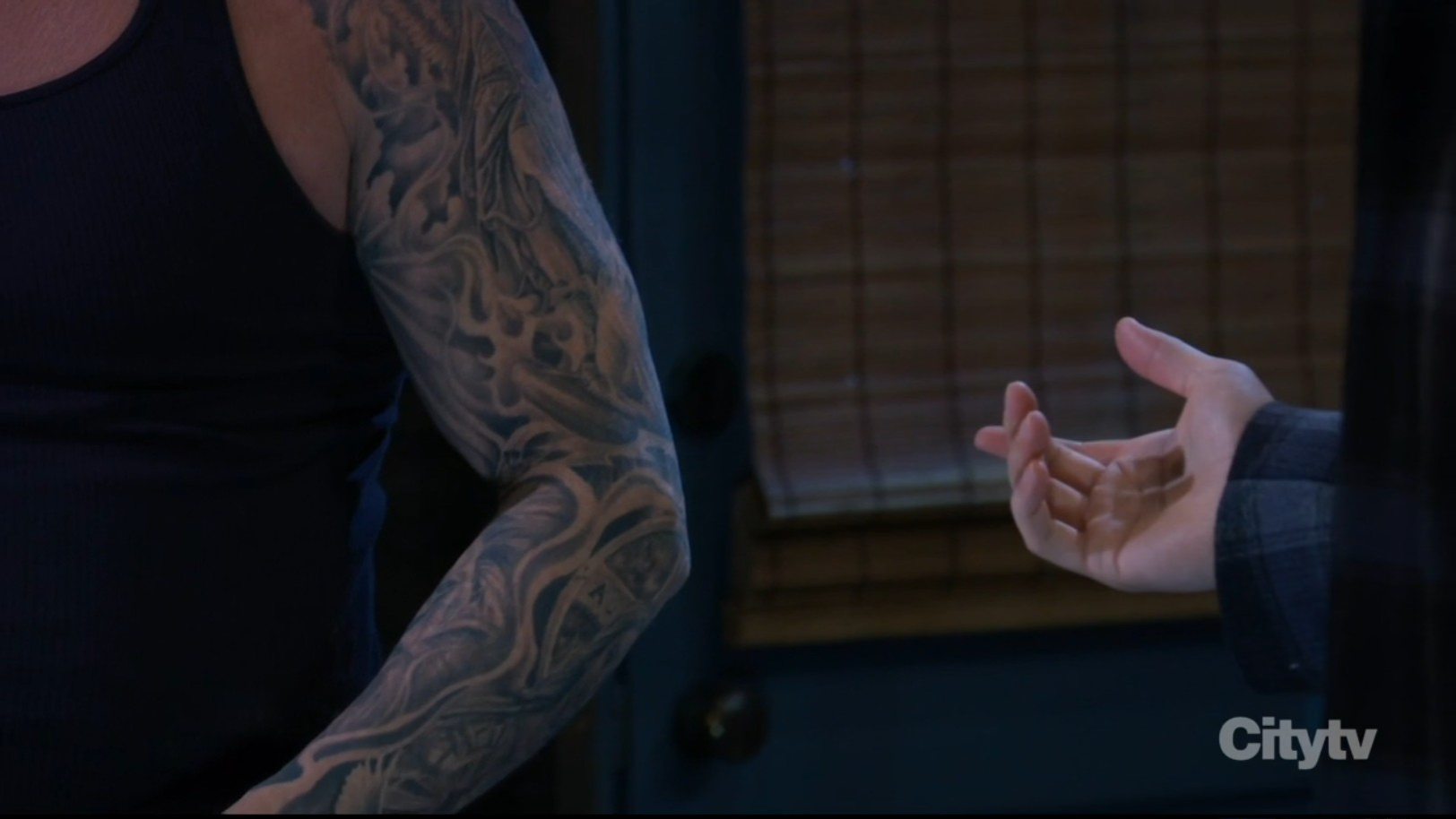 jason shows his tattoos to michael
